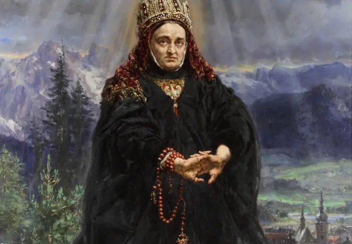 Portret kobiety w koronie i czarnej szacie, z różańcem w dłoniach, na tle górskiego krajobrazu.